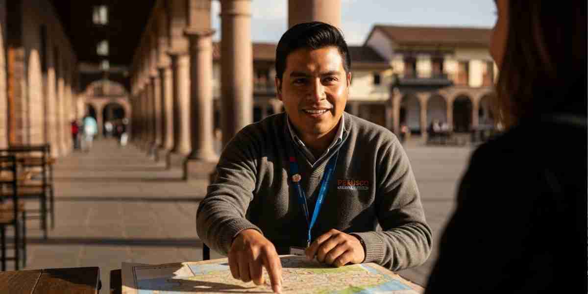 A welcoming guide from a local Cusco agency discussing a map with a traveler in the Plaza de Armas in Cusco.