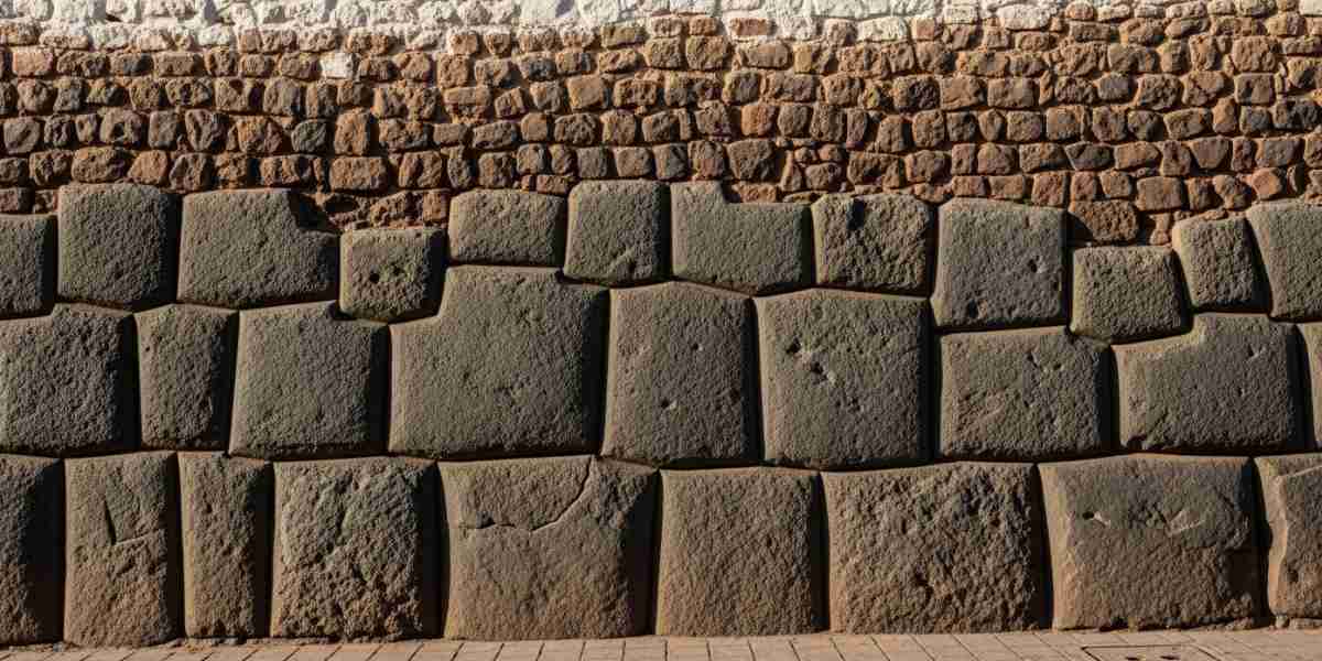 A detailed view of a historic wall showcasing Spanish colonial architecture built upon a perfect Inca stone foundation, illustrating the deep history explored during conscious travel in Cusco.