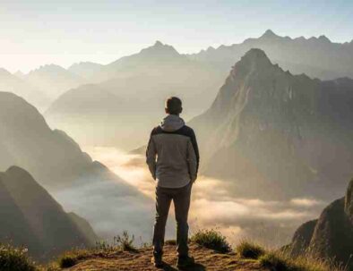 A traveler stands on an Andean peak overlooking a misty valley at sunrise, illustrating the paradox of your itinerary where true discovery begins when you let go of the map.