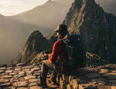 A lone trekker pausing on a high Andean pass, embodying the concept of transformative travel in Peru.